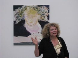 Marlene-Dumas-in-front-of-self-portrait-The-Sleep-of-Reason-2009-press-preview-for-Against-the-Wall-David-Zwirner-2010.jpg