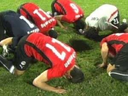 muslim foot ballers praying to the moon god.jpg