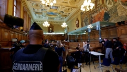 a-french-gendarme-looks-on-as-media-films-the-courtroom-before-the-start-of-the-trial-of-abdelkader-merah-brother-of-mohammed-merah-who-killed-7-people-in-2012-at-the-courthouse-in-paris_5954920.jpg